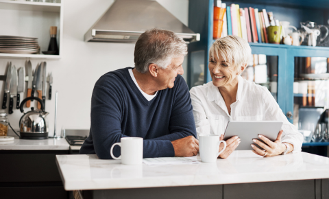 Older couple sitting in kitchen