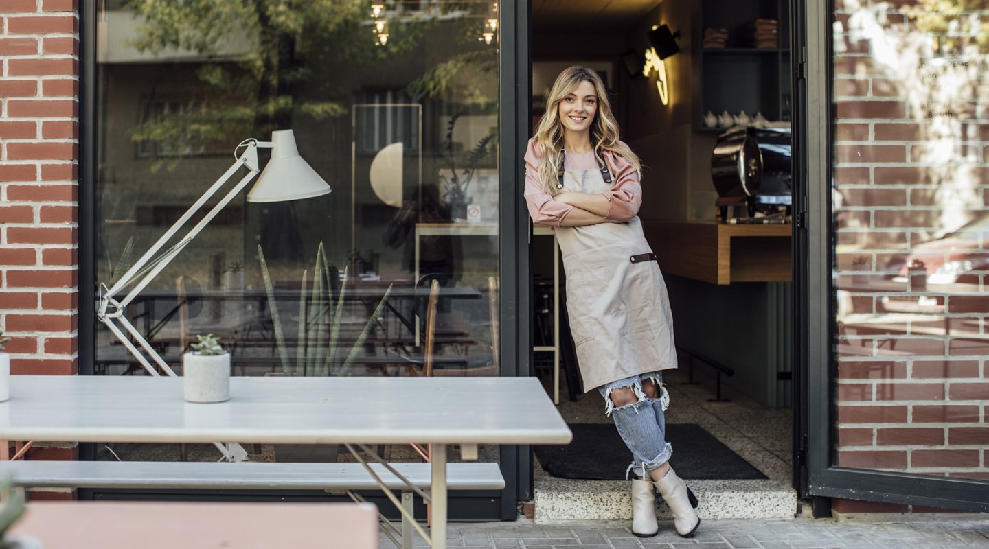 Female business owner outside shop