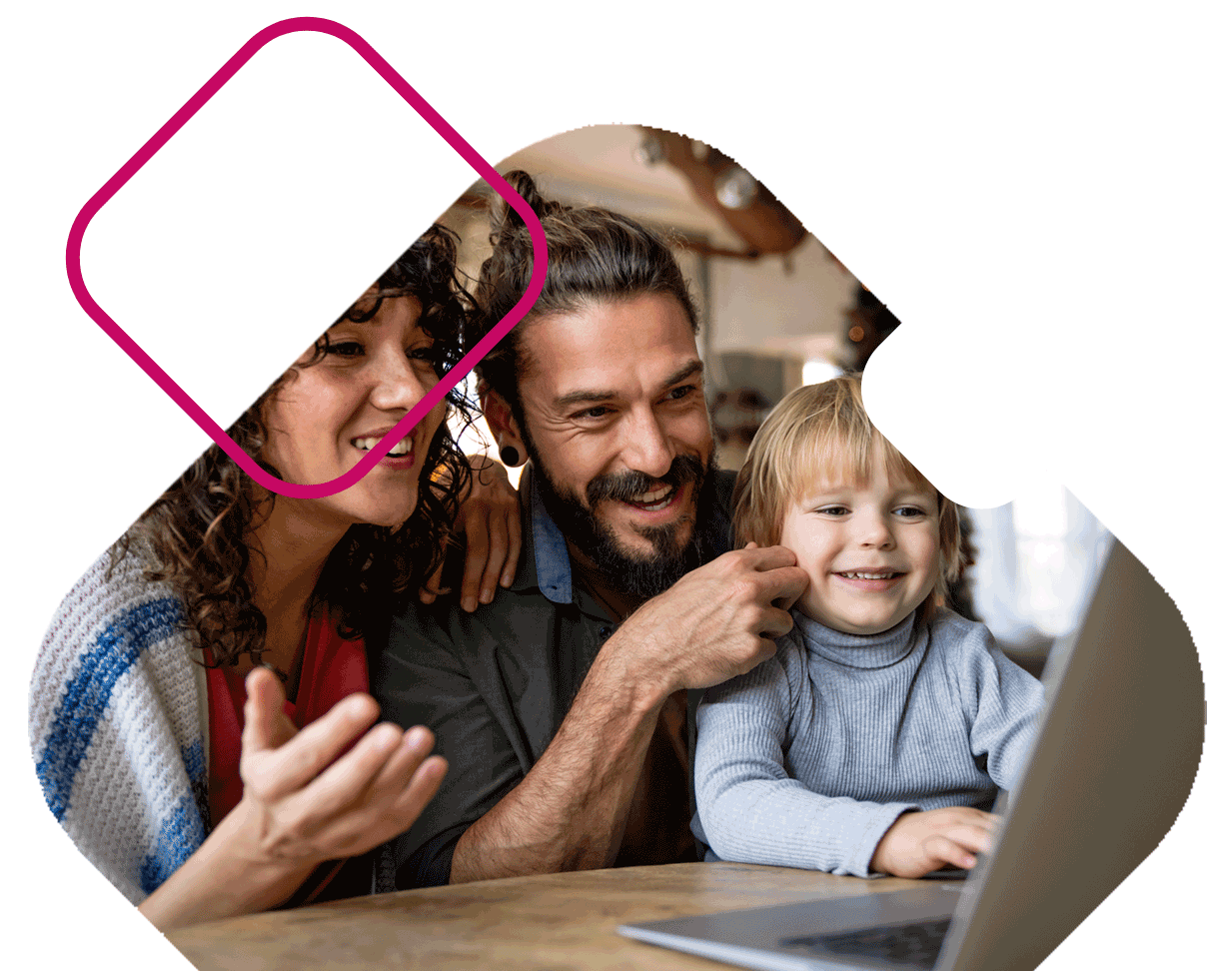 Family On Laptop At Kitchen Table