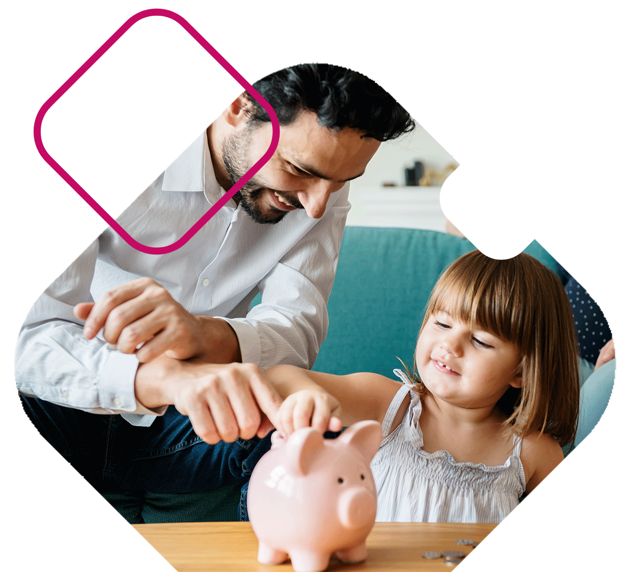 Dad with daughter putting coins in piggy bank