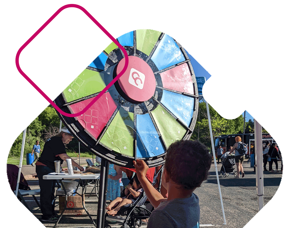 Boy At CCCU Event Spinning Prize Wheel