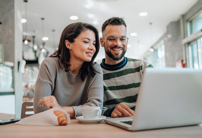 Couple Looking At Laptop